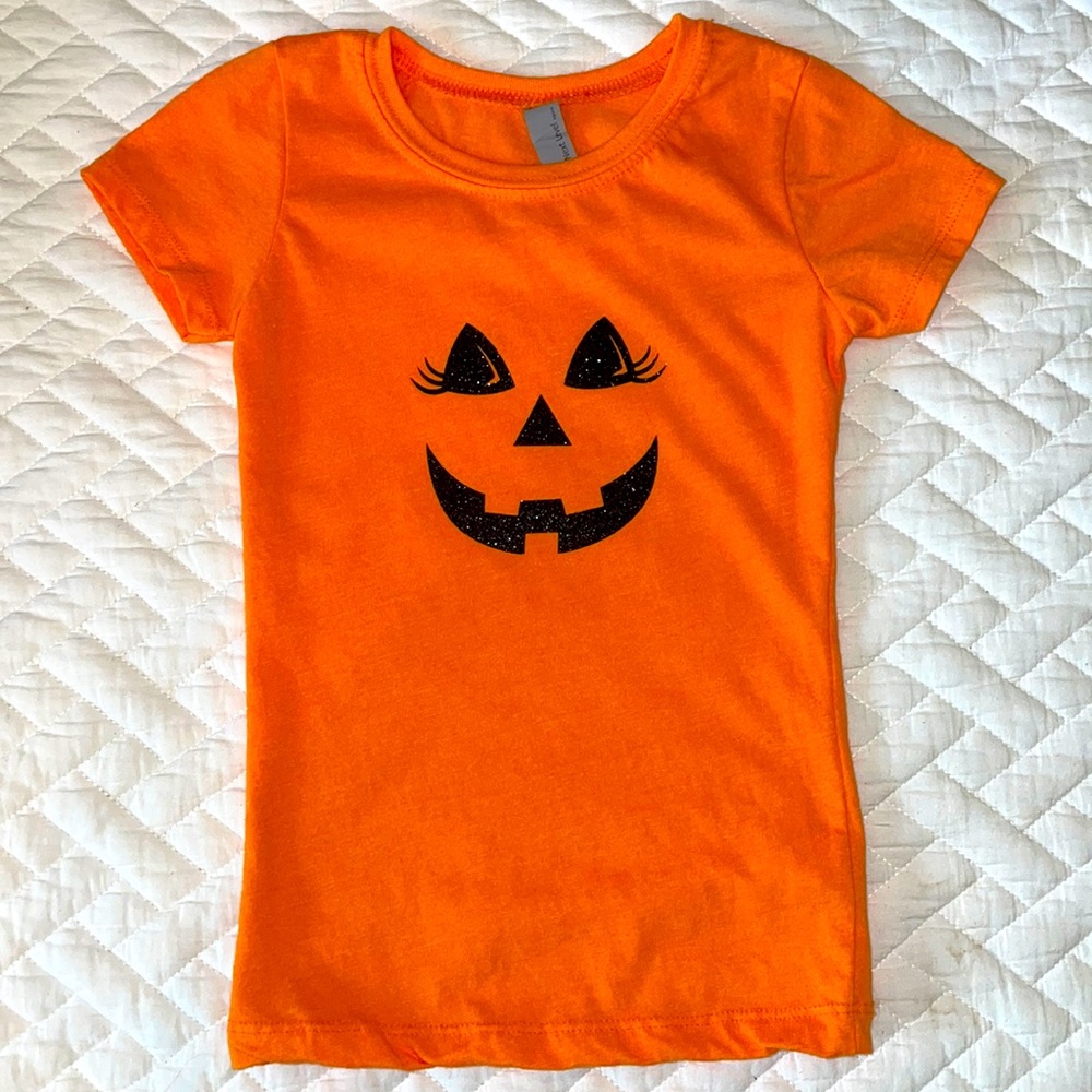 Orange Jack o Lantern face with lashes